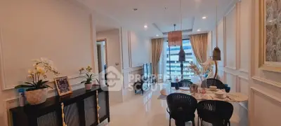 Elegant dining and living area with modern decor and city view, perfect for urban living.