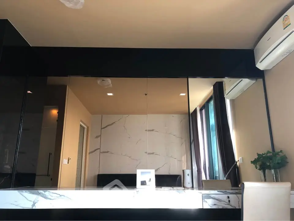 Modern interior with marble accents and air conditioning in a stylish living space.