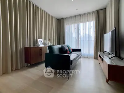 Modern living room with sleek furniture and large windows for natural light