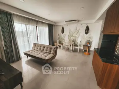 Spacious modern living room with stylish decor and large windows