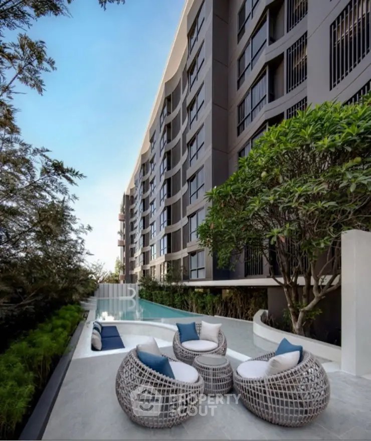 Luxurious outdoor seating area with modern design and lush greenery