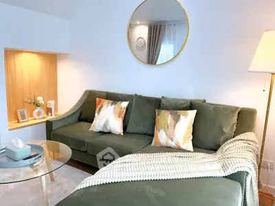 Stylish living room with modern green sofa and elegant decor