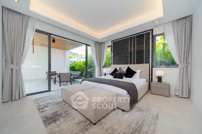 Luxurious bedroom with modern decor and private balcony access