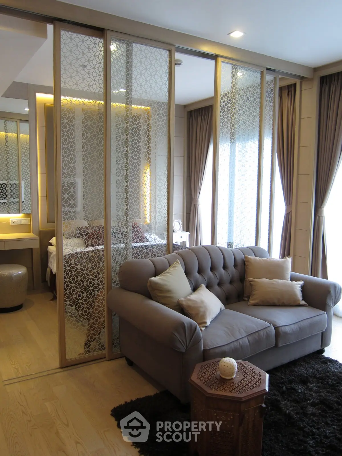 Luxurious living room with elegant decor and sliding partition in modern apartment