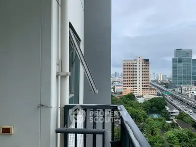 Urban balcony with city skyline view, perfect for enjoying vibrant city life.