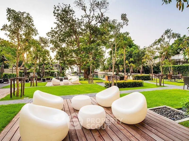 Luxurious garden area with modern seating and lush greenery, perfect for relaxation and outdoor gatherings.