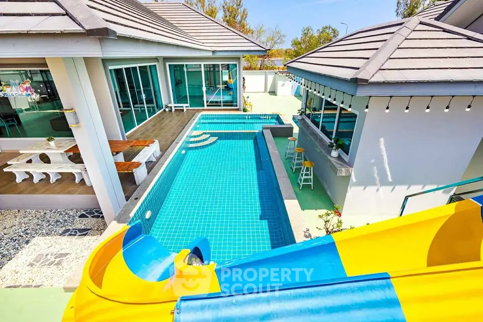 Luxurious villa with private pool and slide, perfect for family entertainment and relaxation.