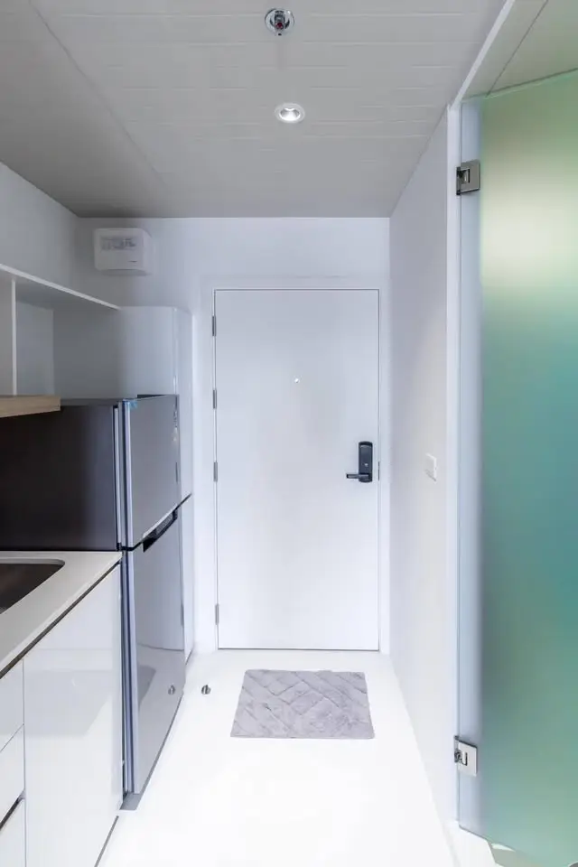 Modern compact kitchen with sleek appliances and minimalist design