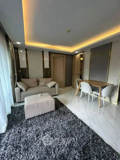 Luxurious modern living room with plush sofa, elegant dining area, and ambient lighting.