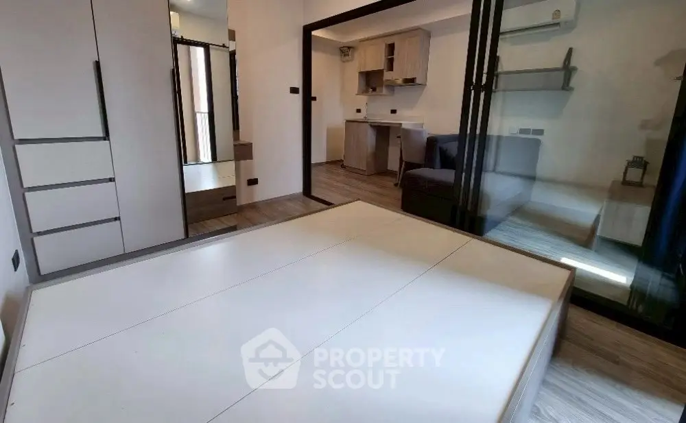 Modern minimalist bedroom with sleek design and ample storage space