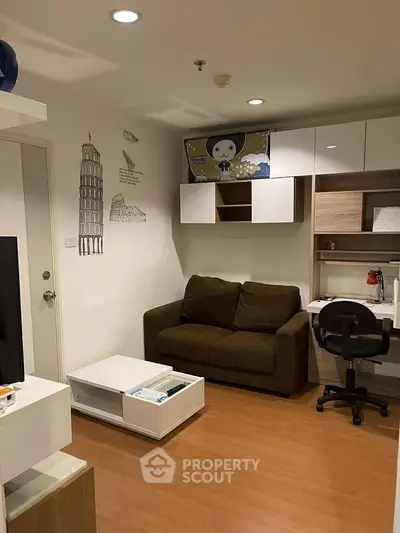 Cozy living room with modern decor and study area, perfect for urban living.