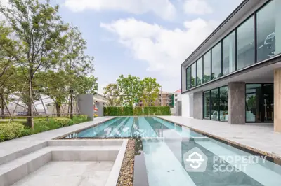 Luxurious modern home with sleek pool and lush garden, perfect for relaxation and entertainment.