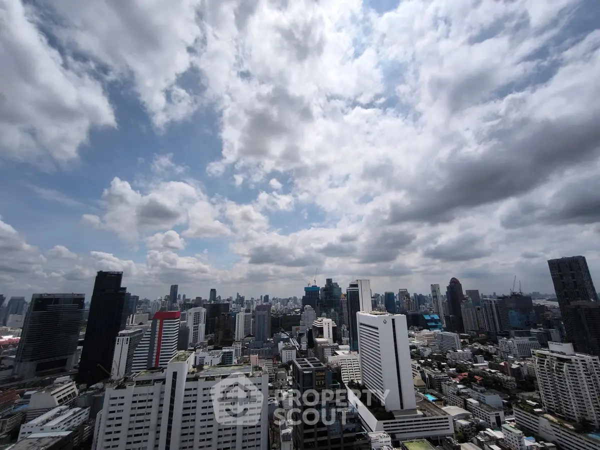Stunning cityscape view showcasing modern skyline under a dramatic cloudy sky.