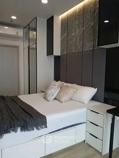 Modern bedroom with stylish decor and built-in storage solutions