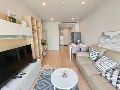 Spacious modern living room with stylish decor and open layout, perfect for relaxation and entertainment.