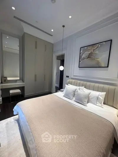 Luxurious bedroom with elegant decor and modern lighting in a high-end apartment.