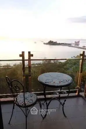 Charming balcony with stunning ocean view, perfect for relaxing and enjoying sunsets.