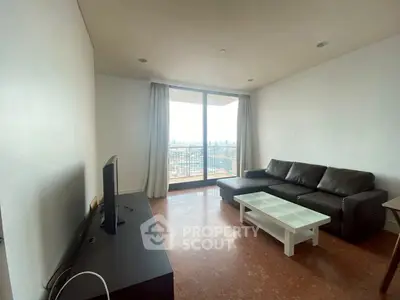 Spacious living room with city view and modern furniture