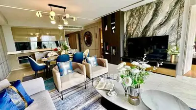 Luxurious modern living room with elegant decor and open kitchen layout