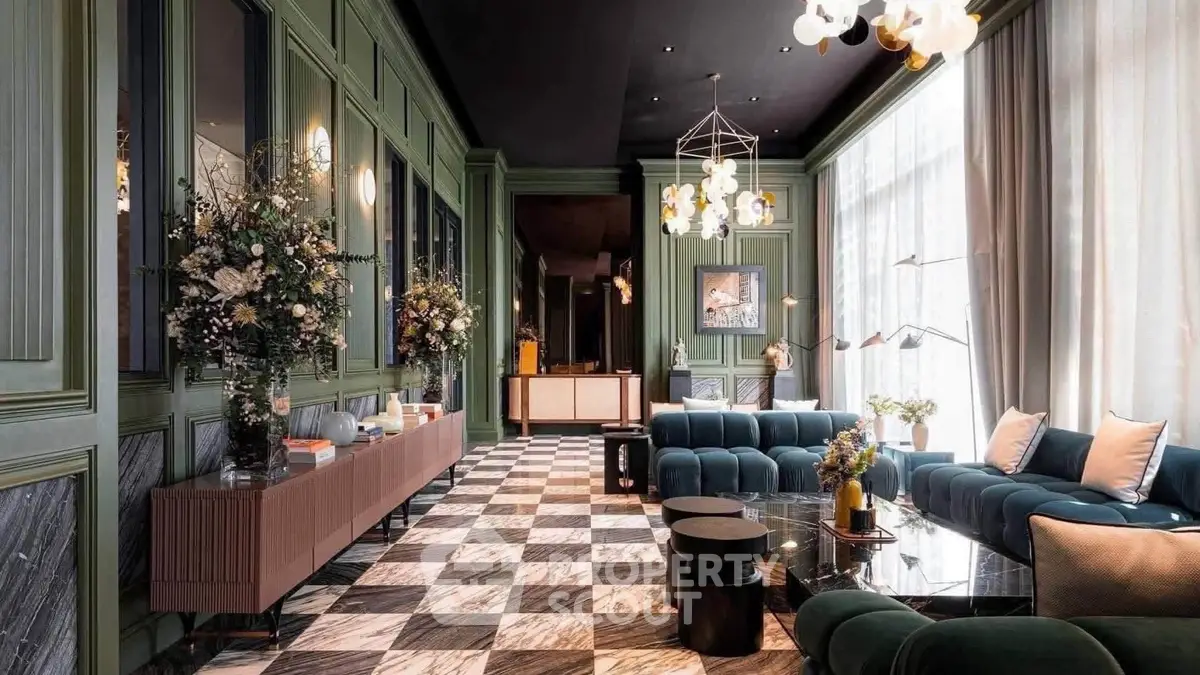 Luxurious living room with elegant decor, plush seating, and large windows for natural light.