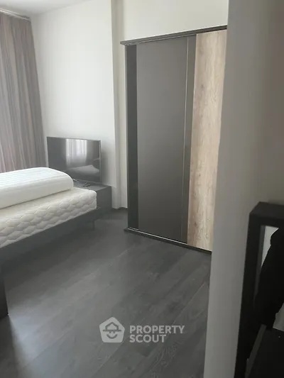 Modern bedroom with sleek wardrobe and minimalist decor