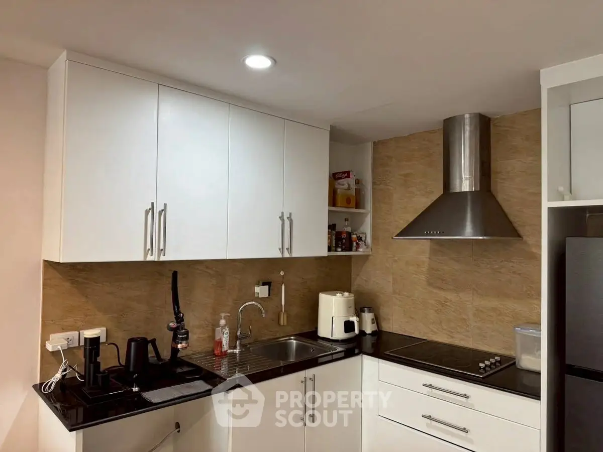 Modern kitchen with sleek cabinets and stainless steel appliances