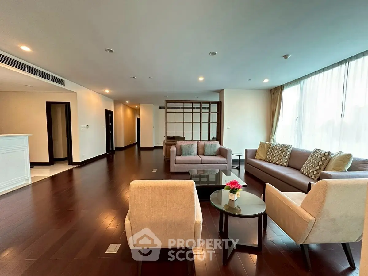 Spacious modern living room with elegant furniture and large windows