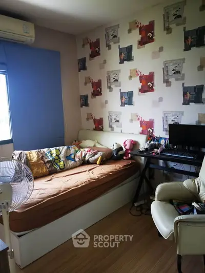 Cozy bedroom with modern decor and workspace, perfect for relaxation and productivity.