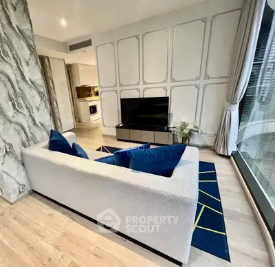 Modern living room with stylish decor and large window view