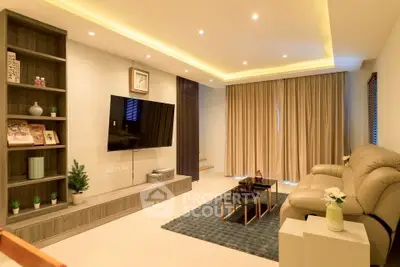 Modern living room with sleek design, cozy seating, and ambient lighting for a luxurious lifestyle.