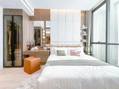 Modern bedroom with stylish decor and large windows for natural light