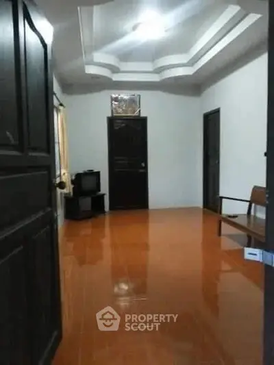 Spacious interior with glossy tiled floor and modern ceiling design