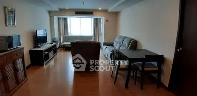 Spacious living room with modern furniture and large window view