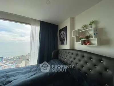 Luxurious bedroom with stunning ocean view and elegant decor