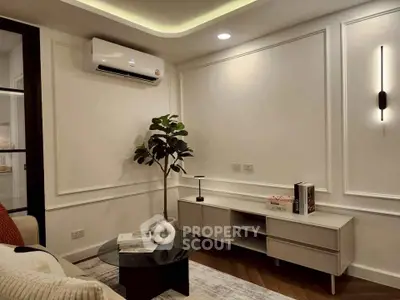 Modern living room with sleek furniture and elegant wall lighting