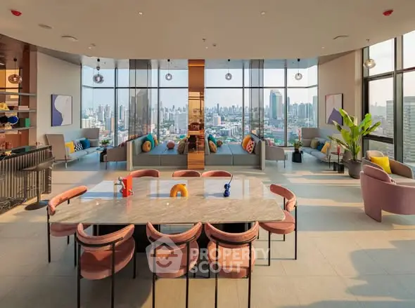 Luxurious open-plan living room with panoramic city views and modern decor.