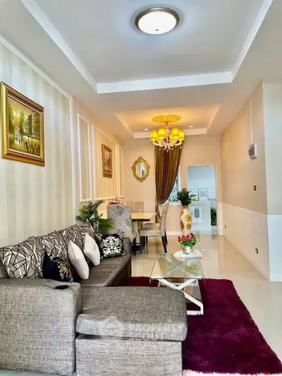 Elegant living room with modern decor and plush seating in a stylish apartment.