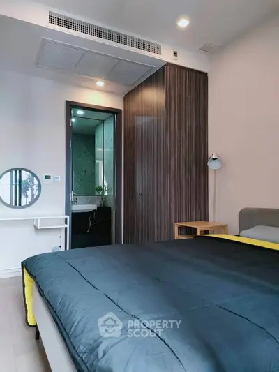 Modern bedroom with sleek design and ensuite bathroom