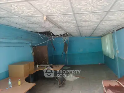 Spacious office space with unique ceiling design and ample natural light.