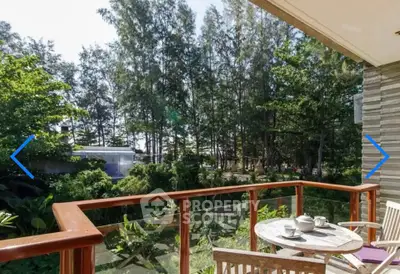 Charming balcony with lush garden view, perfect for relaxing mornings with coffee.