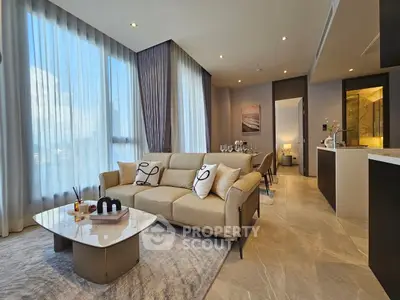 Luxurious modern living room with elegant decor and open kitchen layout