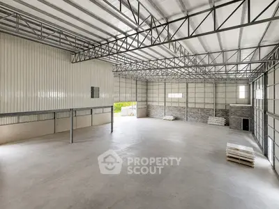 Spacious industrial warehouse with high ceilings and ample natural light