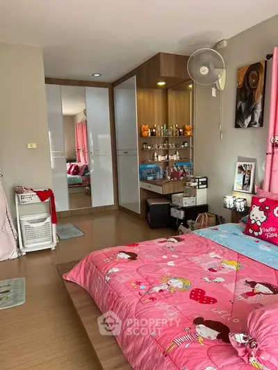 Charming bedroom with playful decor and ample storage space