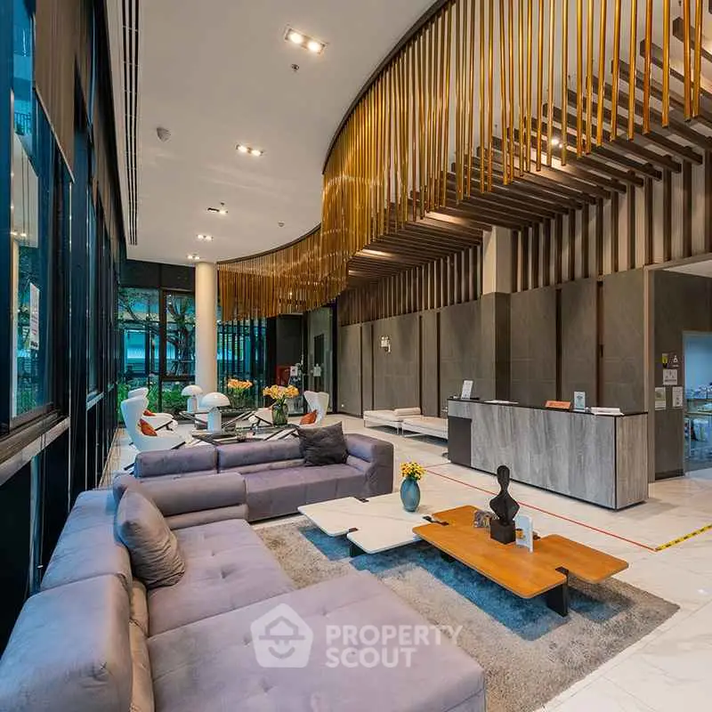 Luxurious modern lobby with elegant seating and stylish decor in a high-end residential building.