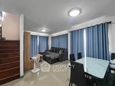 Spacious living room with modern furniture and elegant dining area