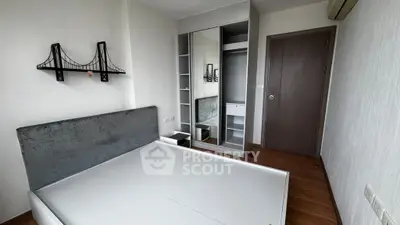 Modern bedroom with stylish decor and built-in wardrobe