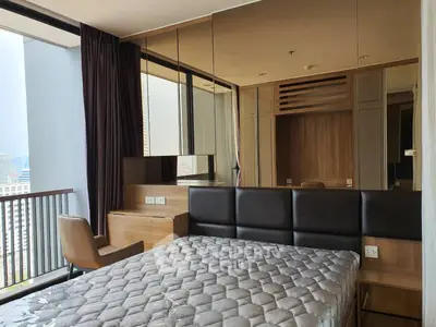 Modern bedroom with city view and stylish decor