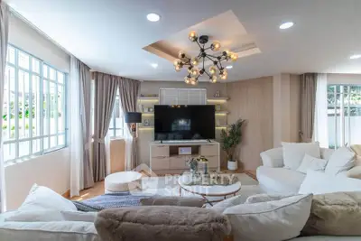 Spacious and stylish living room with modern decor and large windows for natural light.