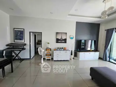 Spacious living room with modern decor and natural light