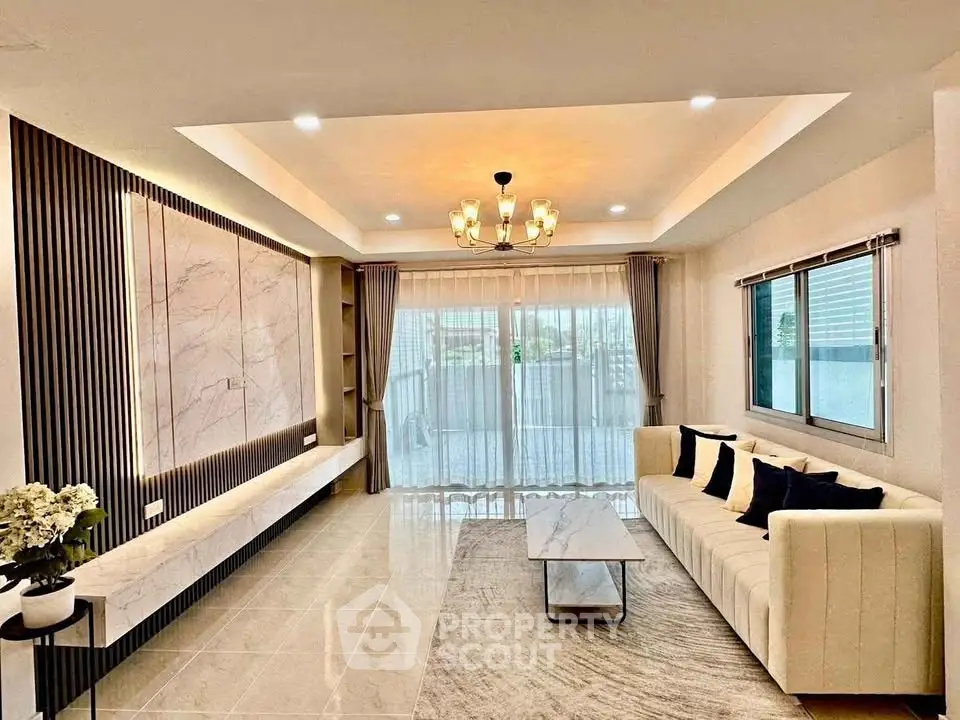 Elegant living room with modern decor and large windows for natural light.